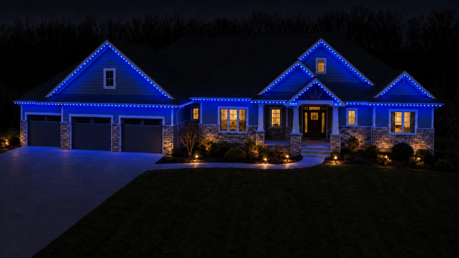 A home at night with its entire roofline lit deep blue